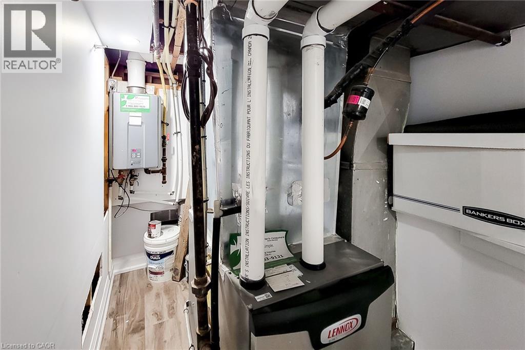 Utilities with heating unit and water heater - 97 Keith Street, Hamilton, ON - Indoor Photo Showing Basement