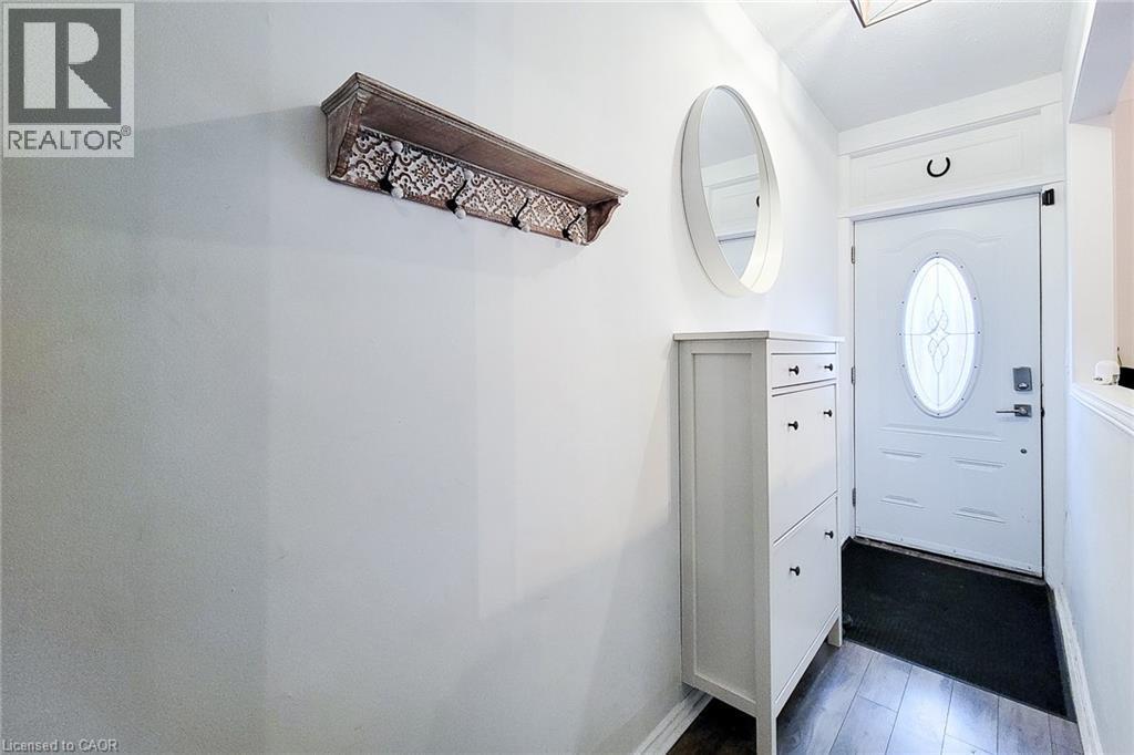 Foyer featuring dark wood finished floors - 97 Keith Street, Hamilton, ON - Indoor Photo Showing Other Room