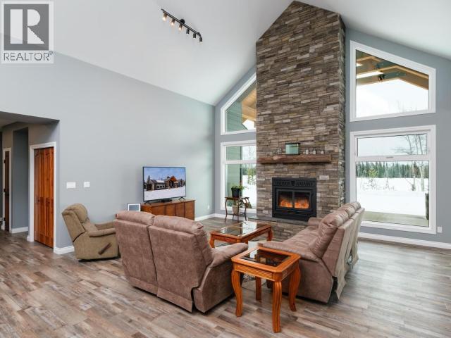 348 Dusty Trail, Whitehorse North, YT - Indoor Photo Showing Living Room With Fireplace