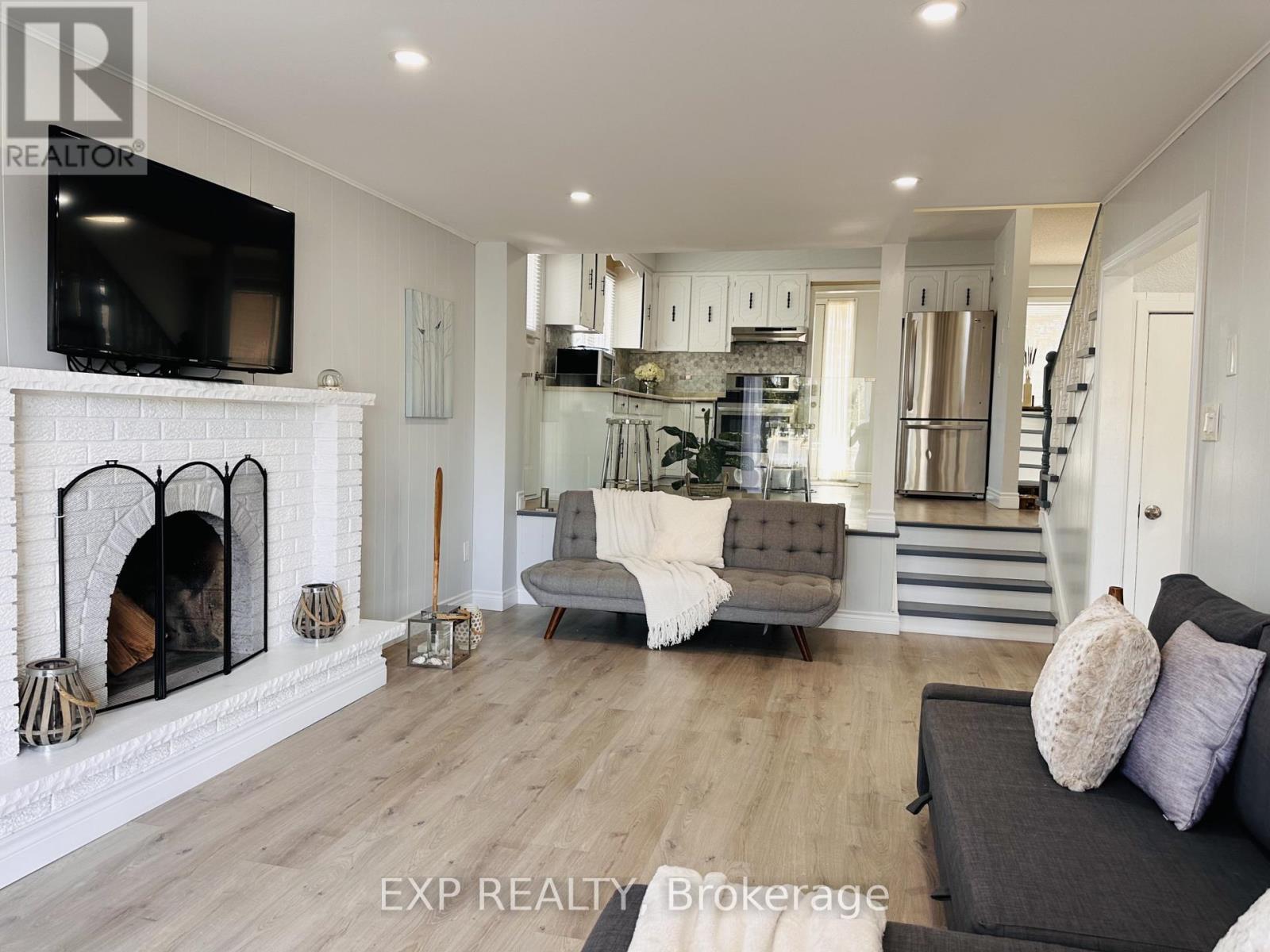 25 Turtle Path, Ramara, ON - Indoor Photo Showing Living Room With Fireplace