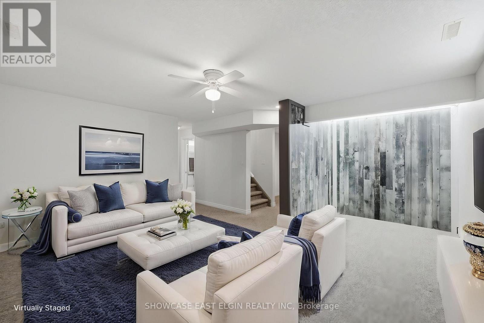 Recreation room is virtually staged - angle 1. - 2 Harrington Crescent, St. Thomas, ON - Indoor Photo Showing Living Room