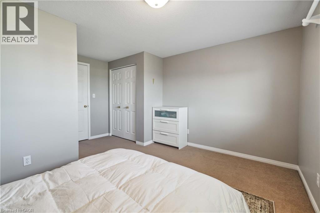 Bedroom featuring light colored carpet and a closet - 27 Red Clover Crescent, Kitchener, ON - Indoor Photo Showing Bedroom