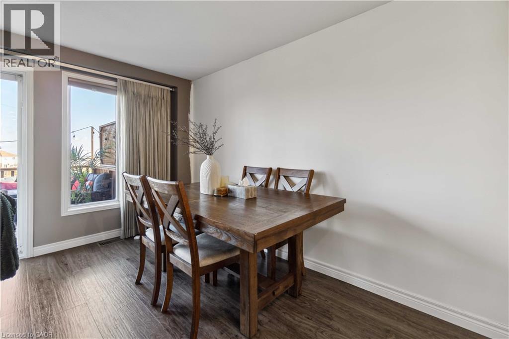 Dining area with dark wood-style flooring - 27 Red Clover Crescent, Kitchener, ON - Indoor Photo Showing Dining Room