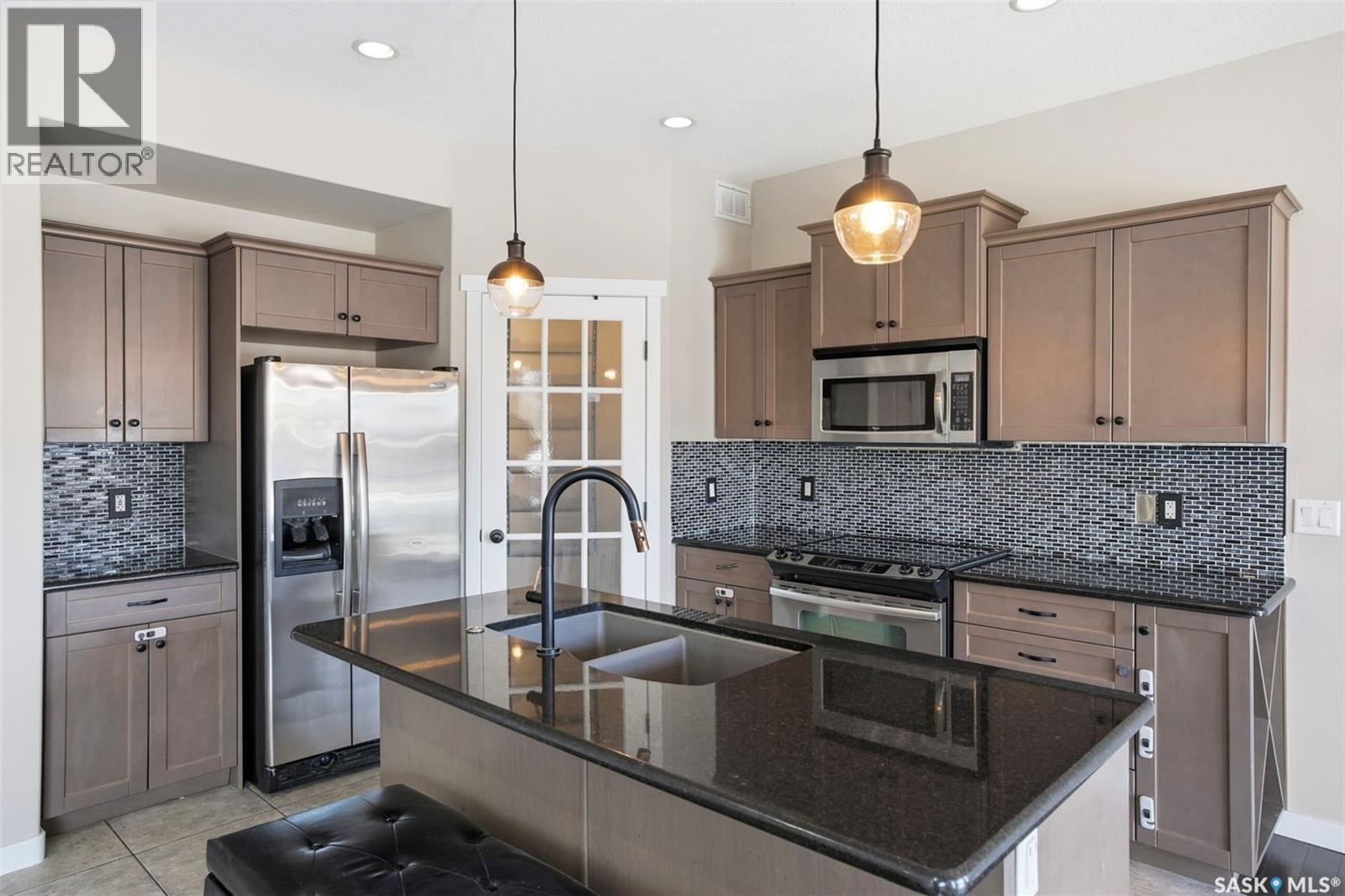 135 Brainerd Crescent, Saskatoon, SK - Indoor Photo Showing Kitchen With Double Sink With Upgraded Kitchen
