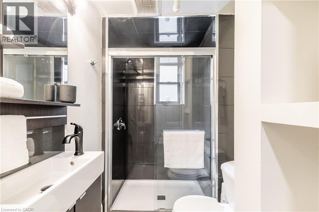 Bathroom featuring a shower stall and vanity - 14 Duke Street, Hamilton, ON - Indoor Photo Showing Bathroom