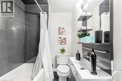 Bathroom with toilet and shower / tub combo -