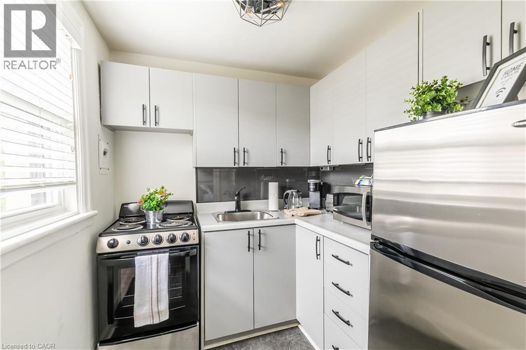 Kitchen with stainless steel appliances and light countertops - 14 Duke Street, Hamilton, ON - Indoor Photo Showing Kitchen