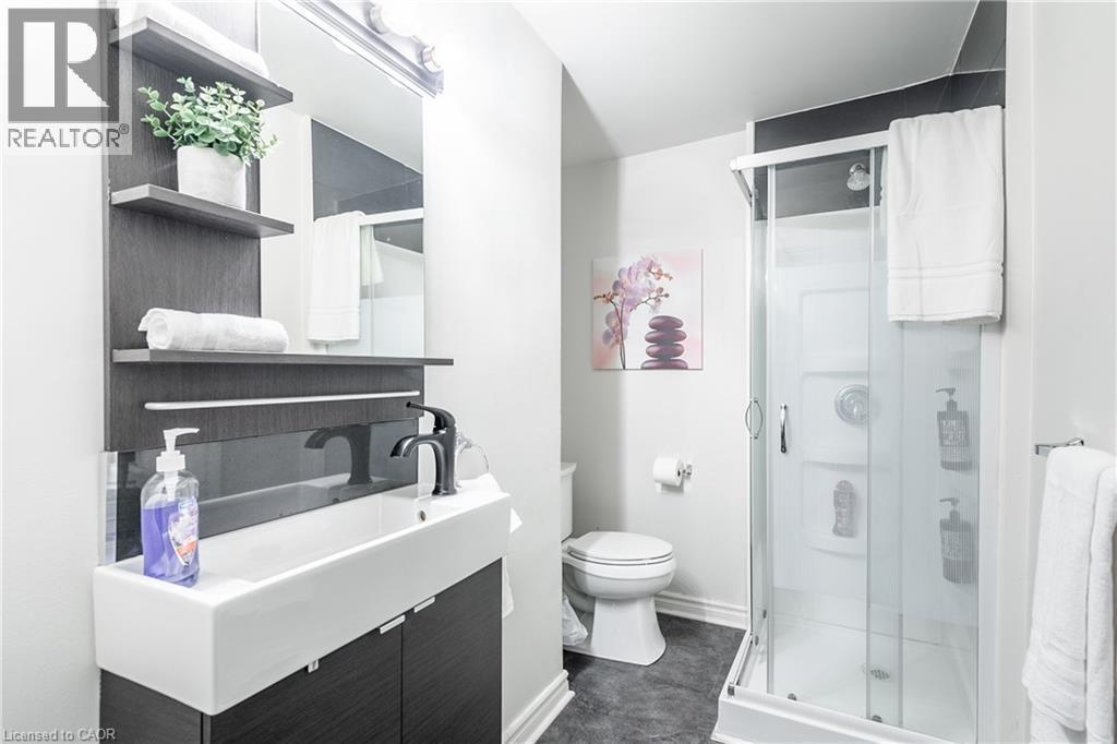 Bathroom featuring vanity and a stall shower - 14 Duke Street, Hamilton, ON - Indoor Photo Showing Bathroom