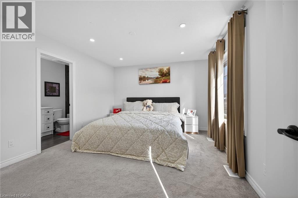Carpeted bedroom with recessed lighting and ensuite bathroom - 80 Severino Circle, Smithville, ON - Indoor Photo Showing Bedroom