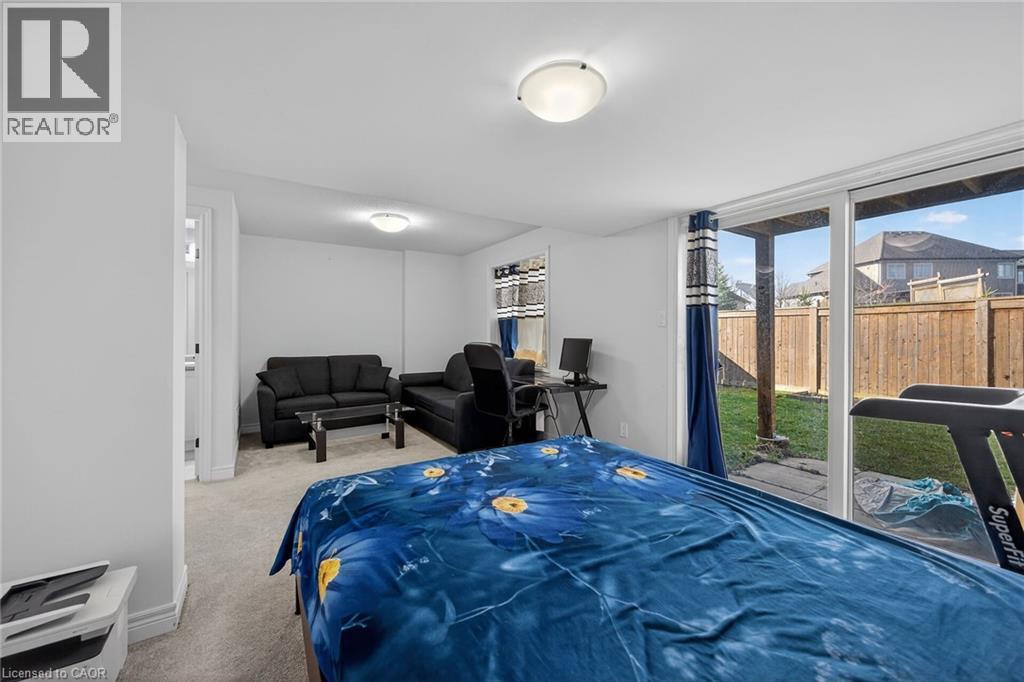 Bedroom with carpet floors and access to exterior - 80 Severino Circle, Smithville, ON - Indoor Photo Showing Bedroom