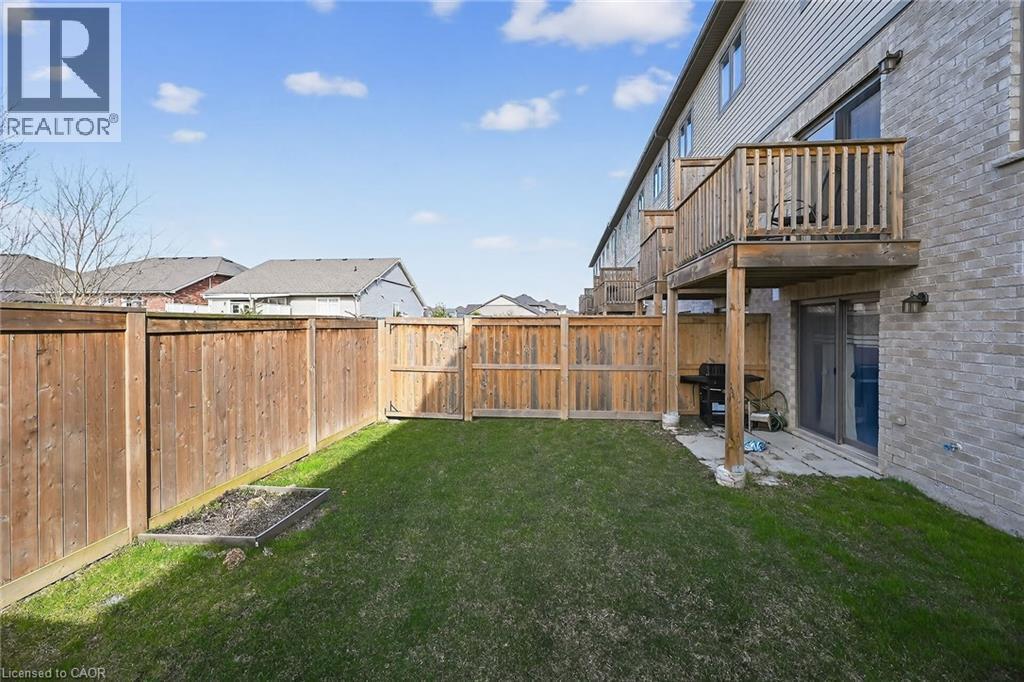 Fenced backyard with a patio and a residential view - 80 Severino Circle, Smithville, ON - Outdoor With Balcony