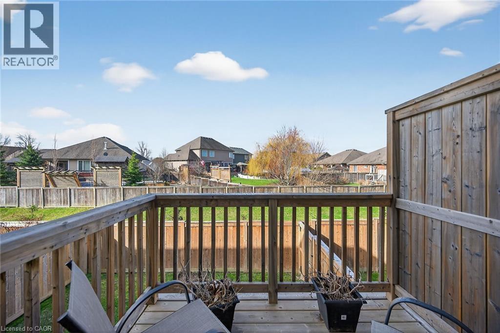 Wooden terrace featuring a residential view and a fenced backyard - 80 Severino Circle, Smithville, ON - Outdoor With Balcony With Exterior