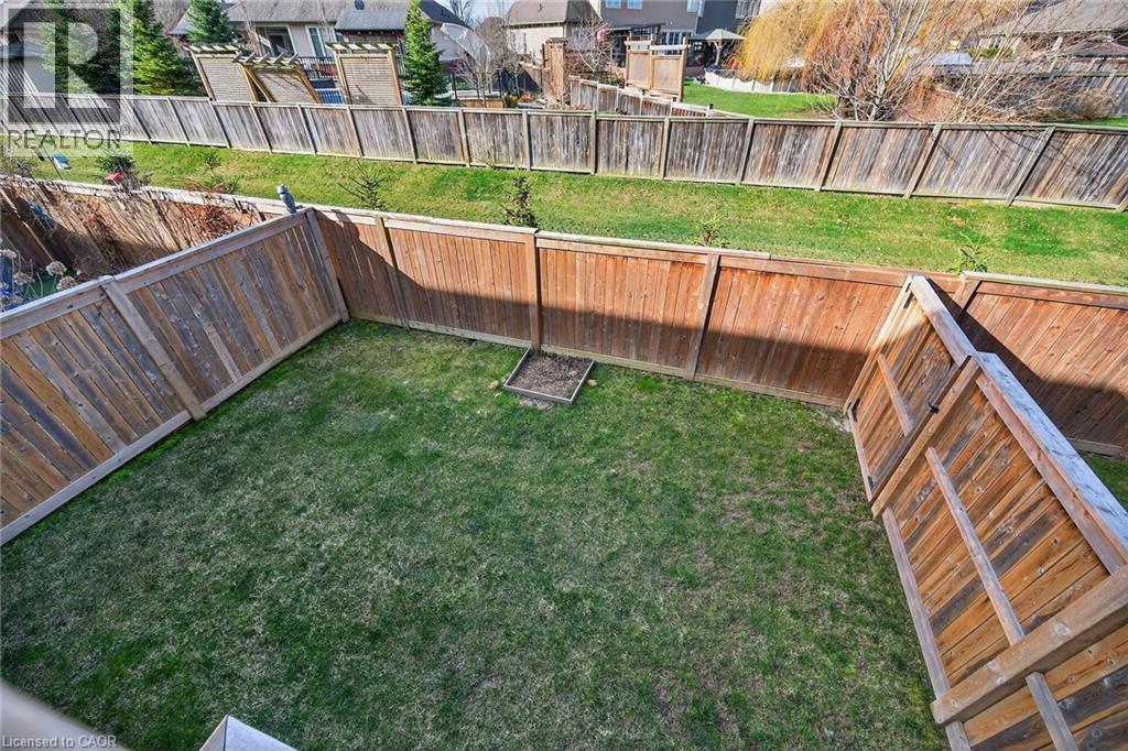 Fenced backyard featuring a residential view - 80 Severino Circle, Smithville, ON - Outdoor With Backyard