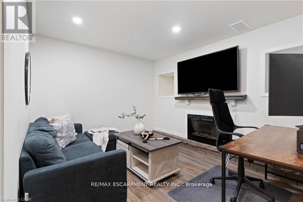 18 Flanders Avenue, St. Catharines, ON - Indoor Photo Showing Other Room With Fireplace