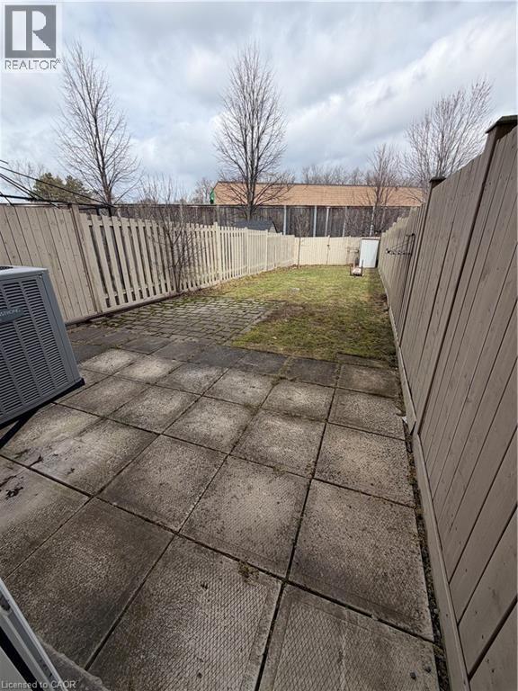 Fenced backyard featuring a patio area - 45 Brookfield Crescent, Kitchener, ON - Outdoor