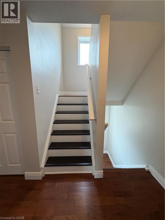 Staircase with wood finished floors and baseboards - 45 Brookfield Crescent, Kitchener, ON - Indoor Photo Showing Other Room