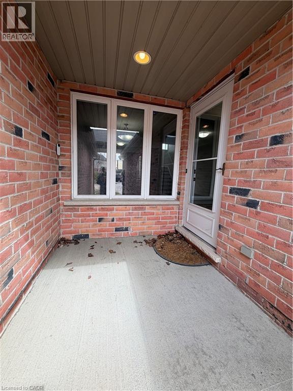 Entrance to property featuring brick siding and a patio area - 45 Brookfield Crescent, Kitchener, ON - Outdoor With Deck Patio Veranda With Exterior