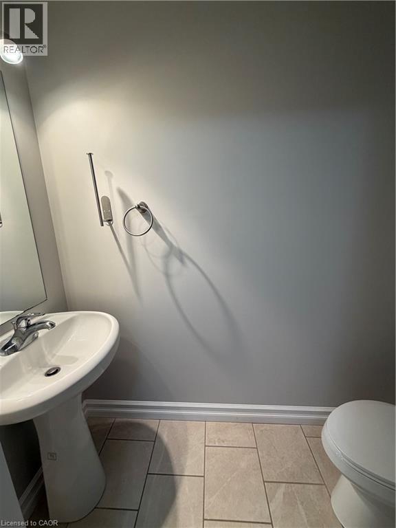 Half bath with light tile patterned floors - 45 Brookfield Crescent, Kitchener, ON - Indoor Photo Showing Bathroom