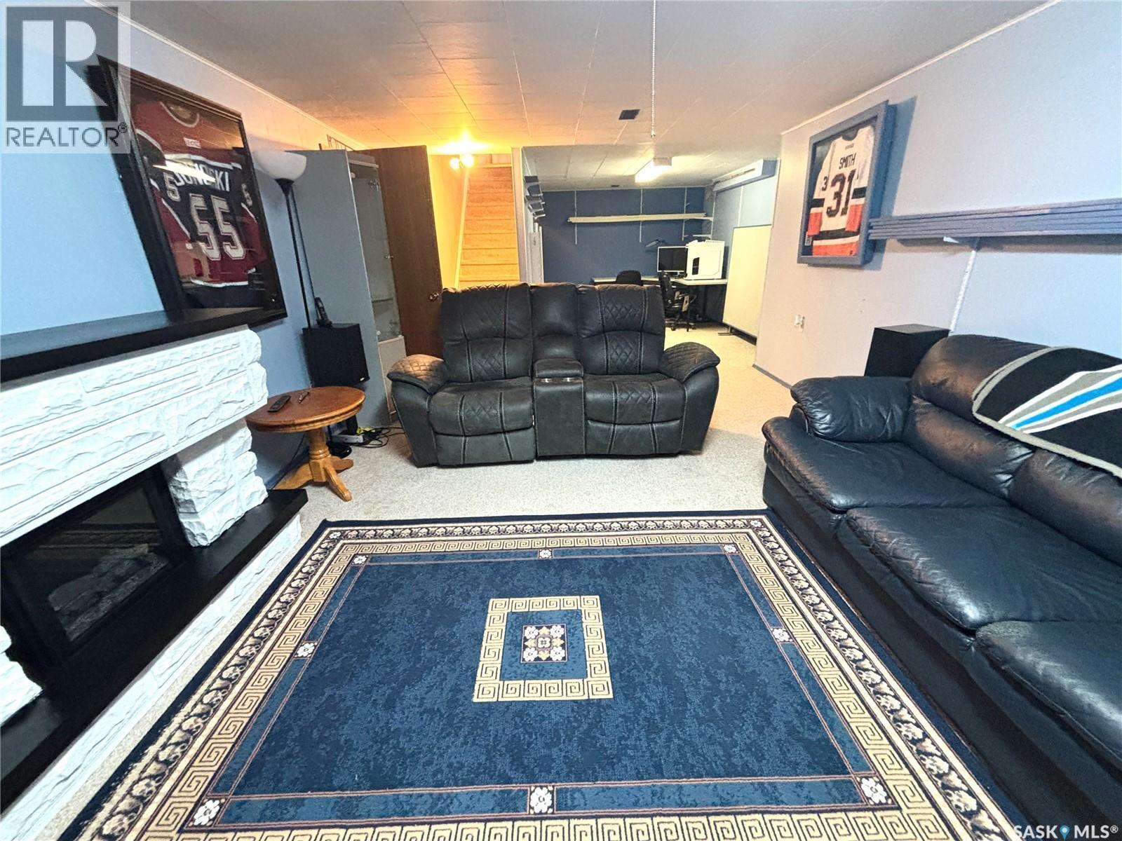 202 Herbert Street, Maple Creek, SK - Indoor Photo Showing Living Room With Fireplace