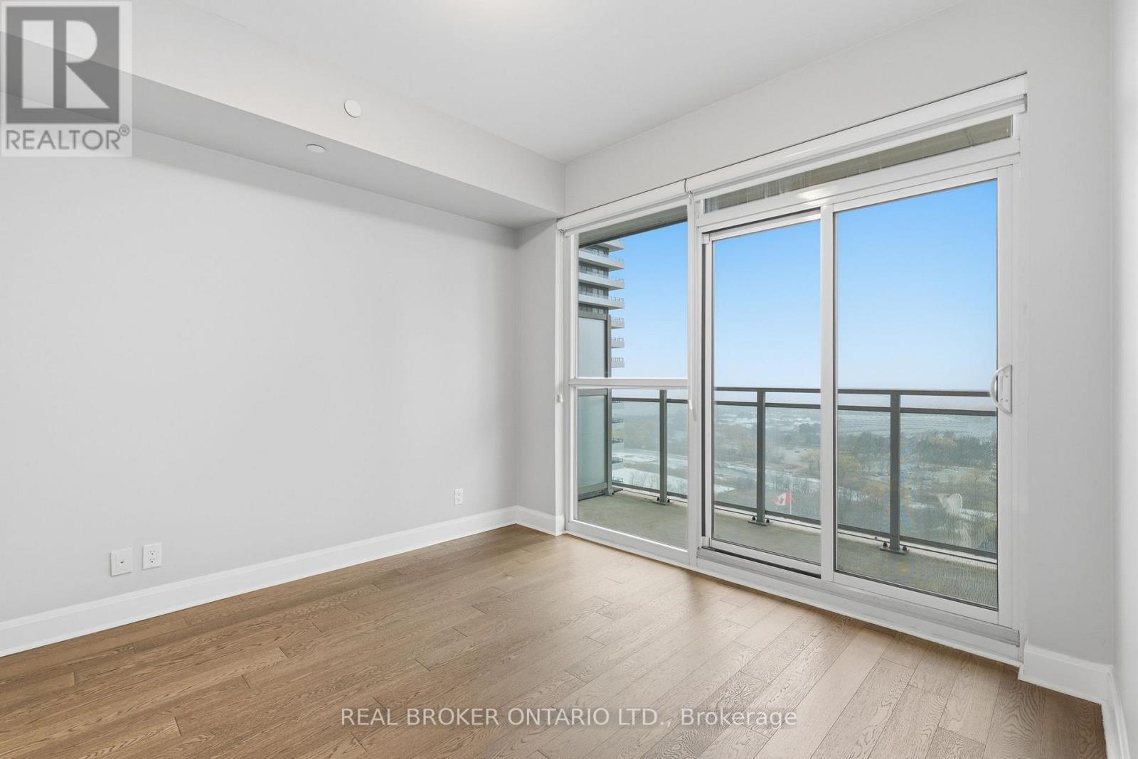 Bedroom with Balcony Access - 1801 - 33 Shore Breeze Drive, Toronto, ON - Indoor Photo Showing Other Room