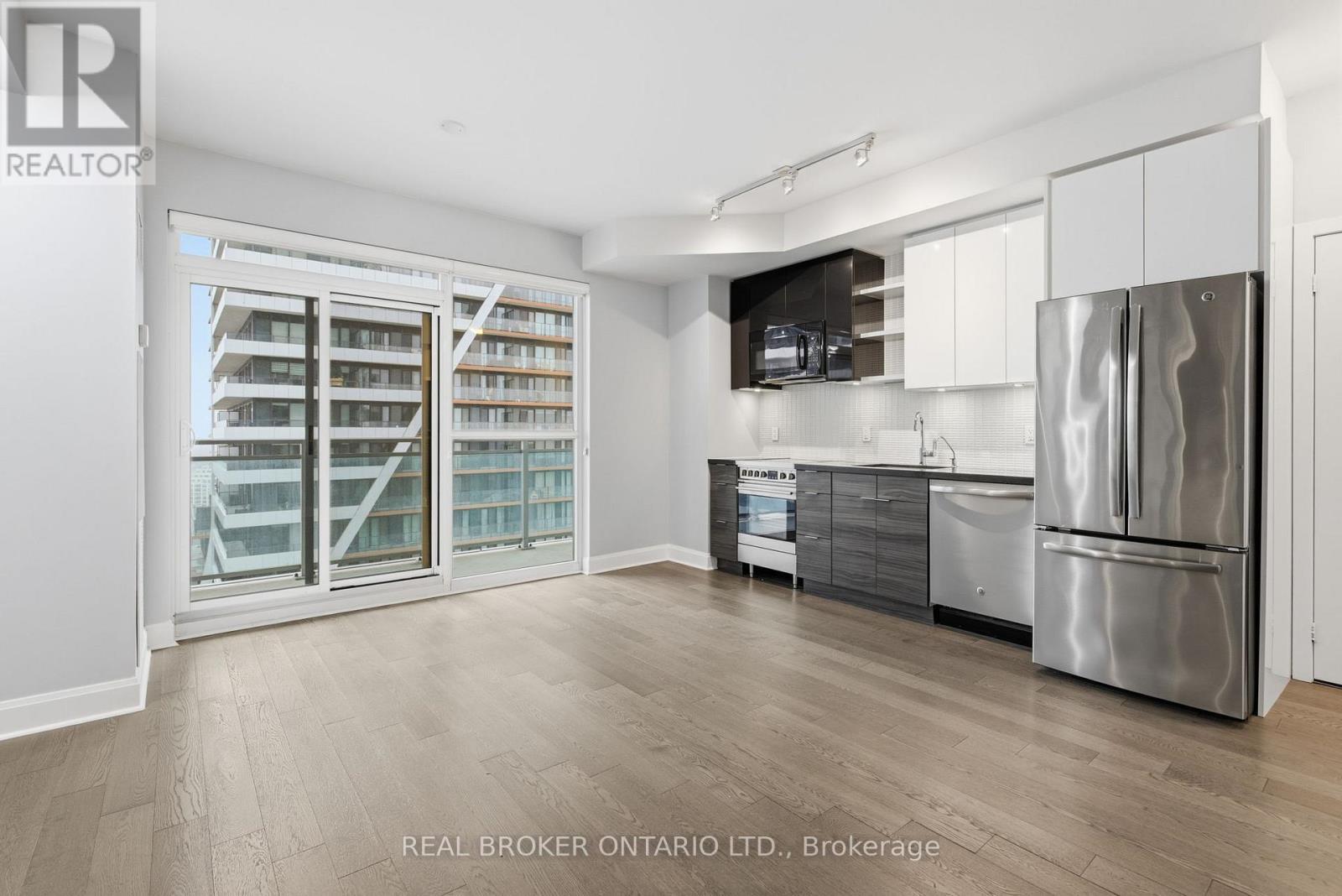Balcony Access Off Main Living Area - 1801 - 33 Shore Breeze Drive, Toronto, ON - Indoor Photo Showing Kitchen With Stainless Steel Kitchen
