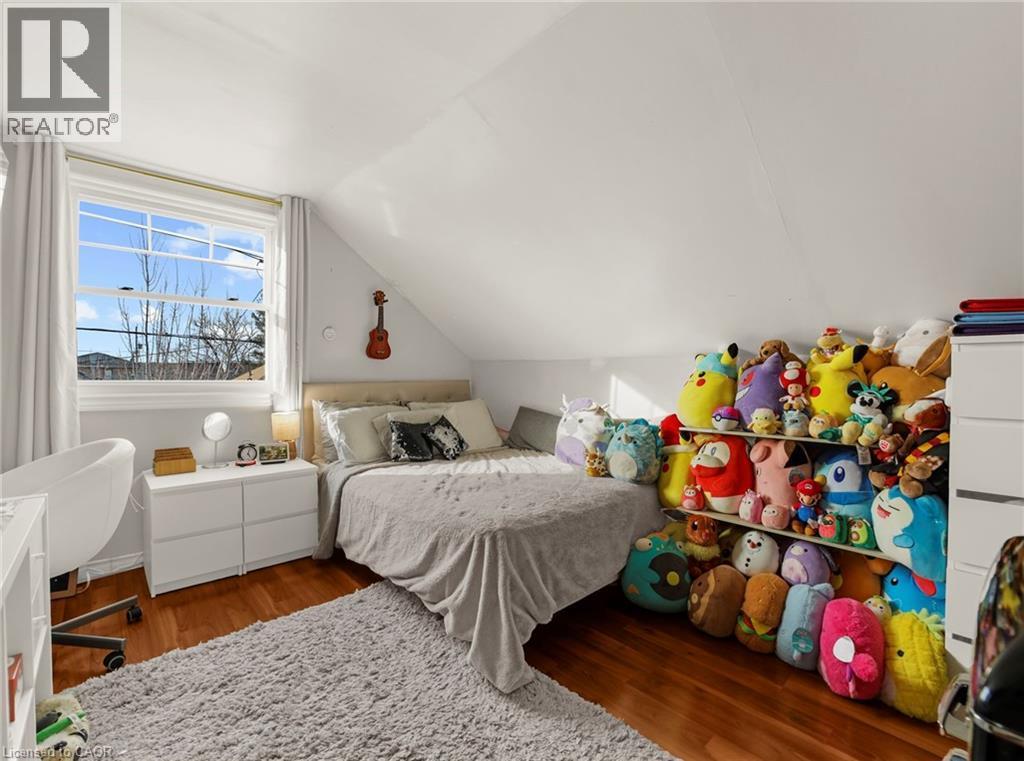 Bedroom featuring dark wood-type flooring and vaulted ceiling - 420 Waverly Street, Hamilton, ON - Indoor Photo Showing Bedroom
