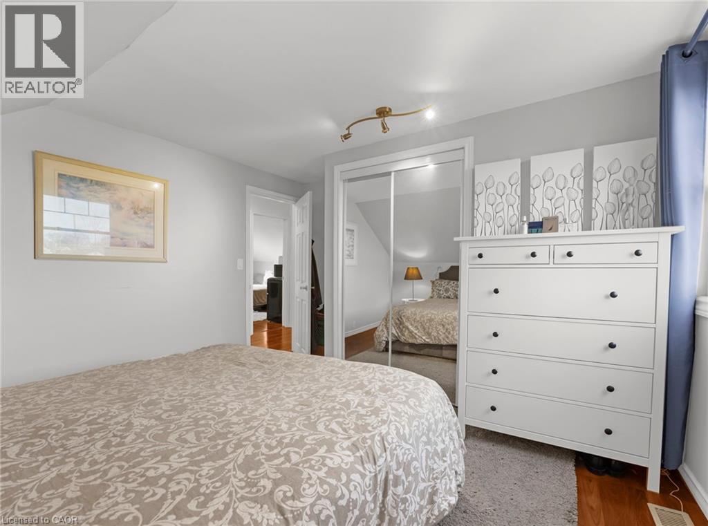Bedroom featuring a closet and dark wood-type flooring - 420 Waverly Street, Hamilton, ON - Indoor Photo Showing Bedroom