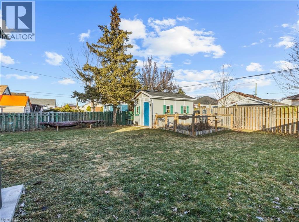 Fenced backyard with a shed with hydro - 420 Waverly Street, Hamilton, ON - Outdoor
