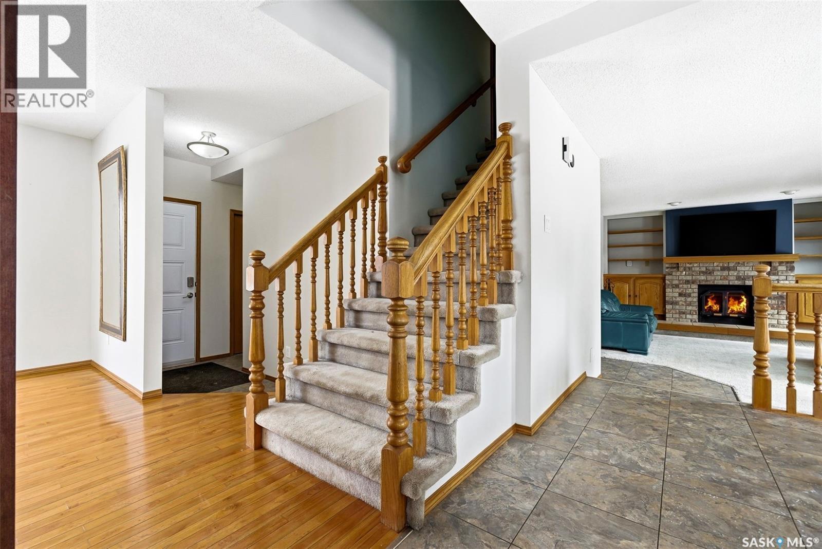 3242 Barton Place E, Regina, SK - Indoor With Fireplace