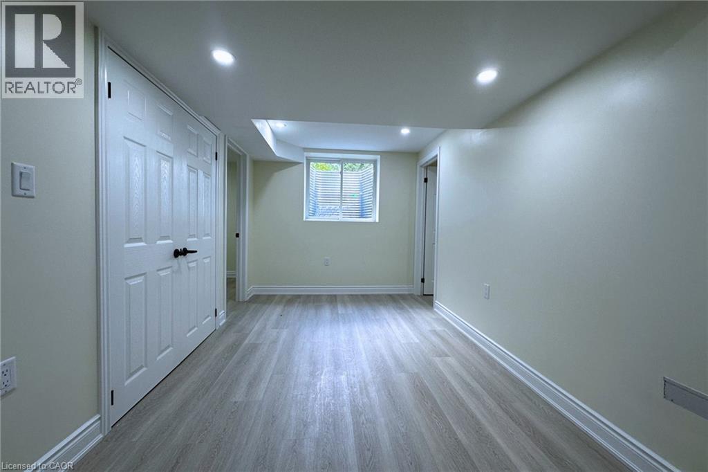 Unfurnished bedroom featuring light wood-type flooring, a closet, and recessed lighting - 59 Windrush Trail S Unit# B, Kitchener, ON - Indoor Photo Showing Other Room