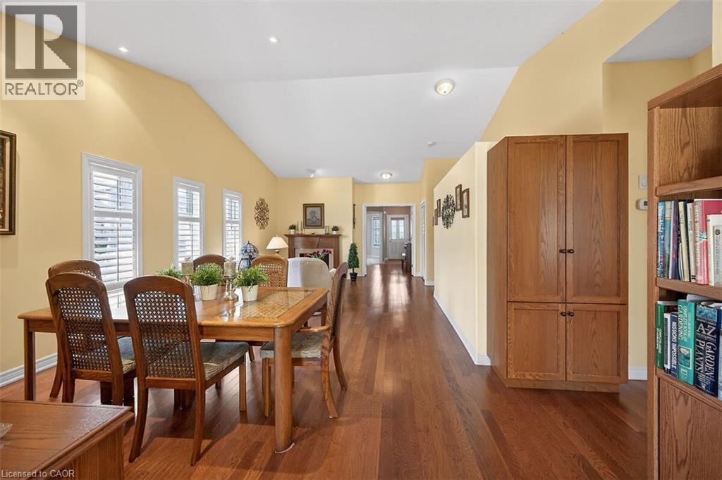 Dining room with dark wood-style floors and lofted ceiling - 48 Hallmark Trail, Hamilton, ON - Indoor Photo Showing Dining Room