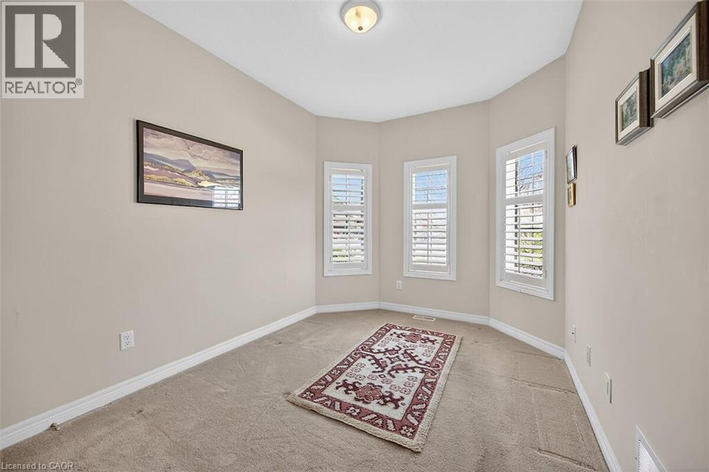 Unfurnished room with light carpet - 48 Hallmark Trail, Hamilton, ON - Indoor Photo Showing Other Room