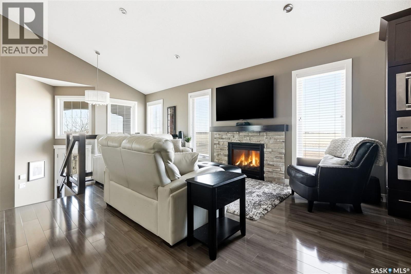4127 Cumberland Road E, Regina, SK - Indoor Photo Showing Living Room With Fireplace