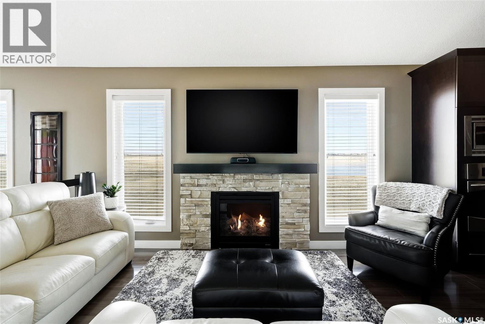 4127 Cumberland Road E, Regina, SK - Indoor Photo Showing Living Room With Fireplace