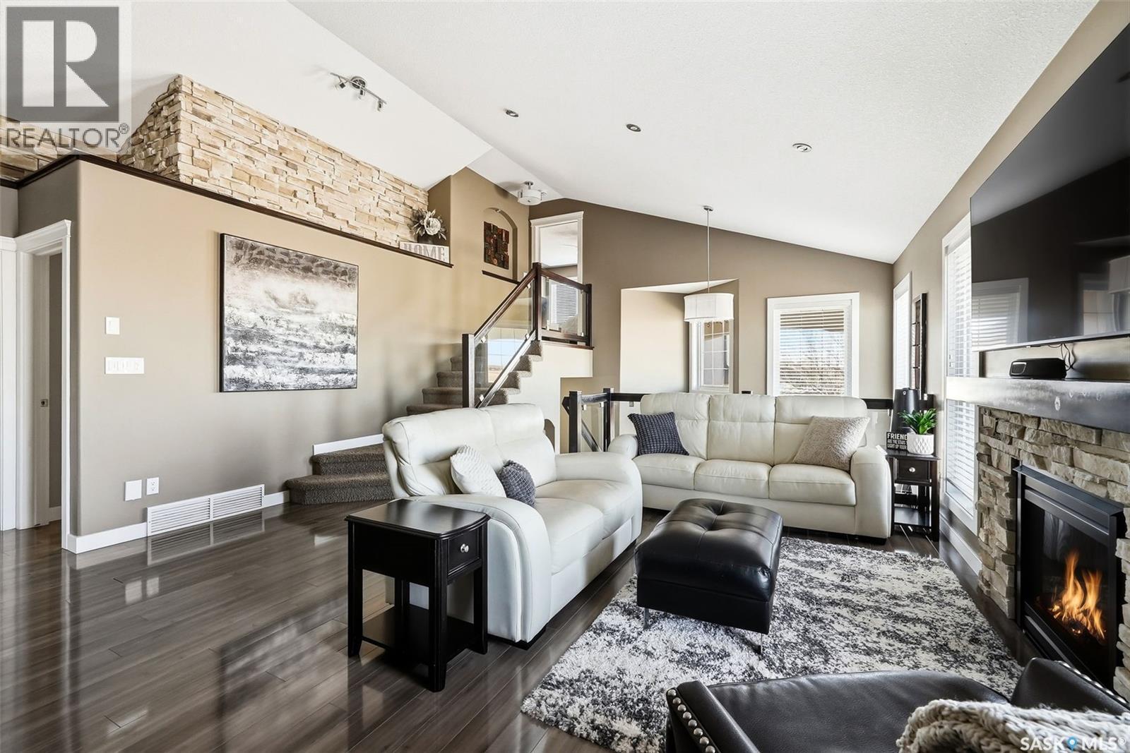 4127 Cumberland Road E, Regina, SK - Indoor Photo Showing Living Room With Fireplace