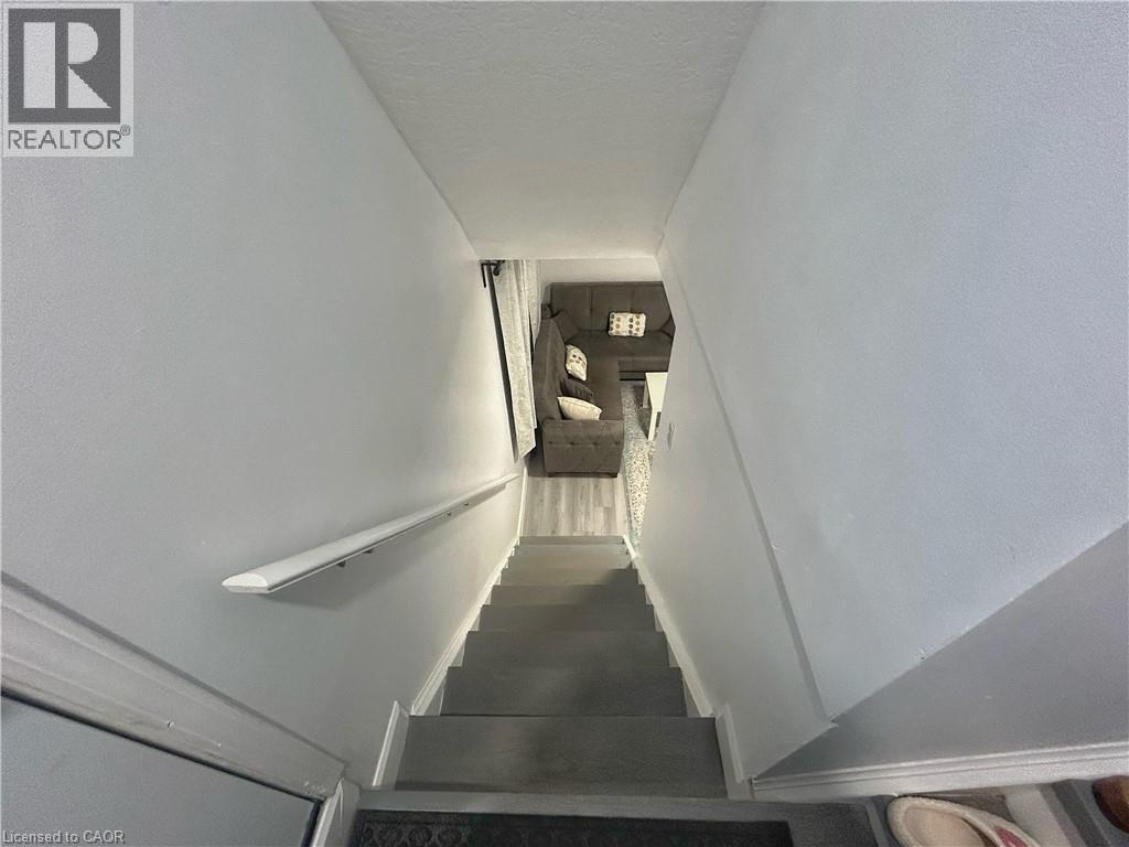 Stairs featuring a textured ceiling - 206A Springfield Crescent Unit# Lower, Waterloo, ON - Indoor Photo Showing Other Room