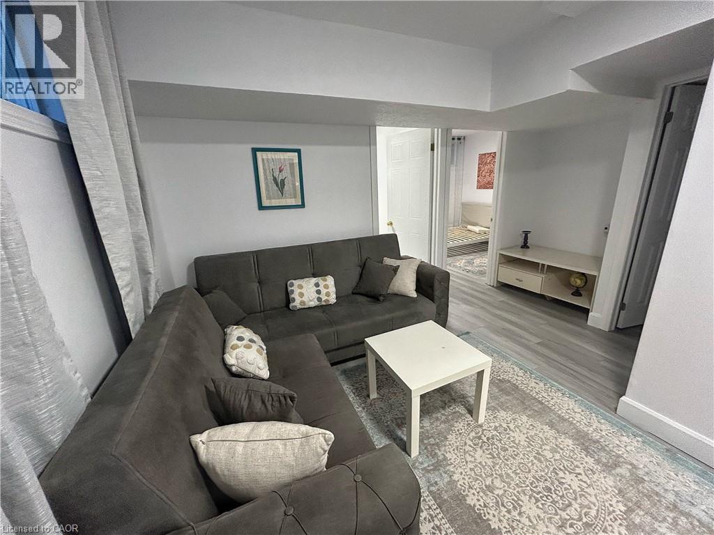 Living room featuring wood finished floors - 206A Springfield Crescent Unit# Lower, Waterloo, ON - Indoor Photo Showing Living Room