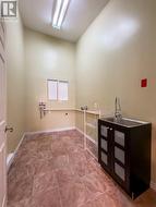 Laundry room off kitchen -