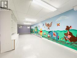 Basement with small doors leading up to the side entrance -