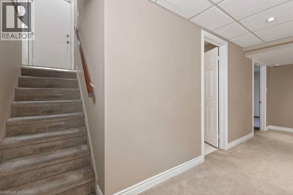 Side door entry plus inside garage entry access to basement - 39 Trenholme Crescent, Hamilton, ON - Indoor Photo Showing Other Room