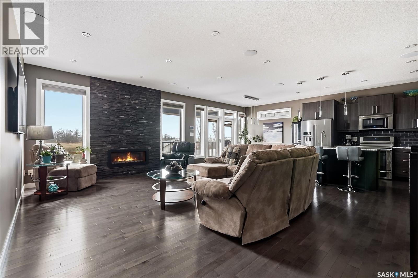 6040 Little Pine Loop, Regina, SK - Indoor Photo Showing Living Room With Fireplace