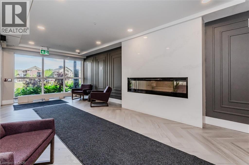 15 Prince Albert Boulevard Unit# 309, Kitchener, ON - Indoor Photo Showing Living Room With Fireplace