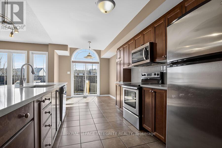 Kitchen to Deck - 672 Pepperville Crescent E, Ottawa, ON - Indoor Photo Showing Kitchen With Upgraded Kitchen