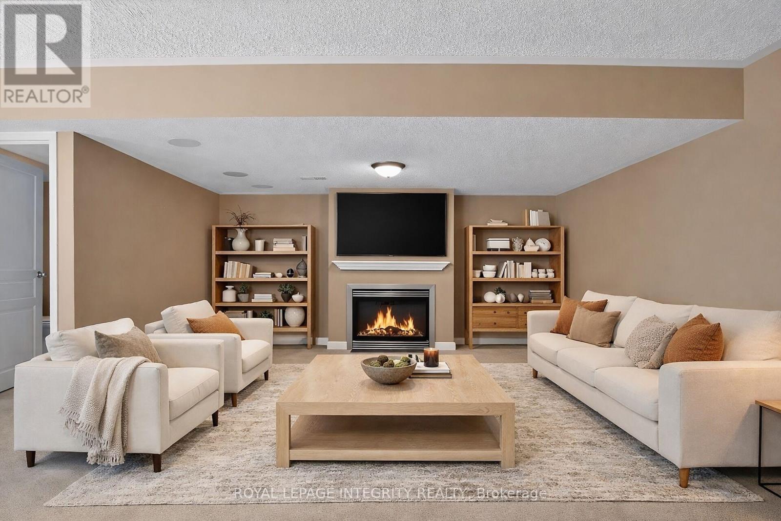 Fireplace Lower Level - 672 Pepperville Crescent E, Ottawa, ON - Indoor Photo Showing Living Room With Fireplace