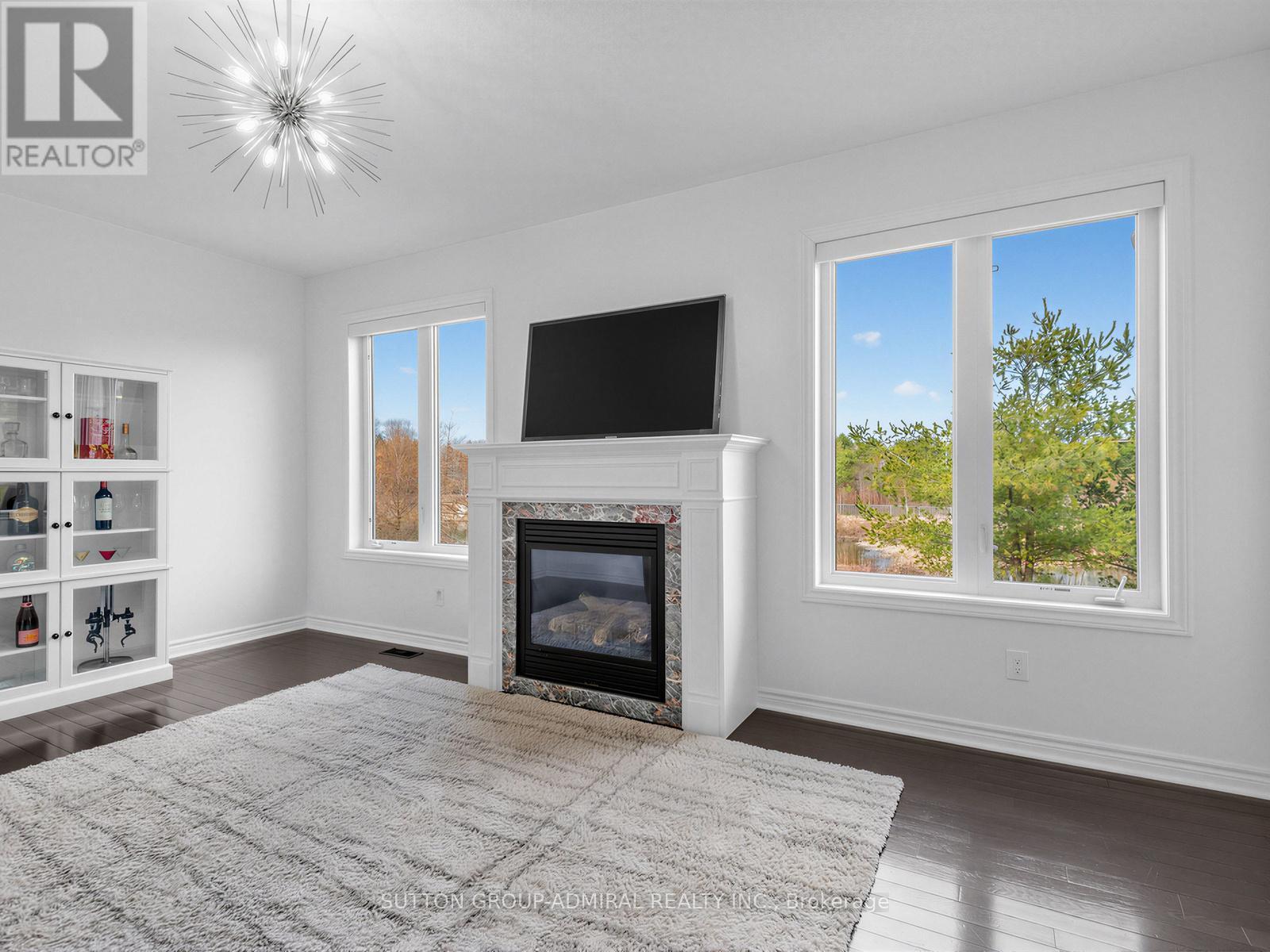 96 Mount Crescent, Essa, ON - Indoor Photo Showing Living Room With Fireplace