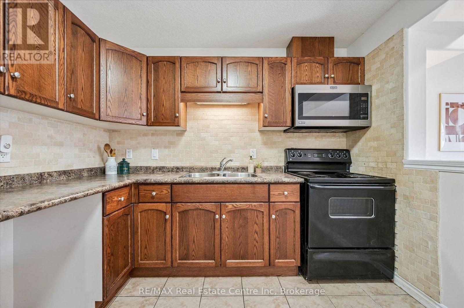 93 Washburn Drive, Guelph (Grange Road), ON - Indoor Photo Showing Kitchen With Double Sink