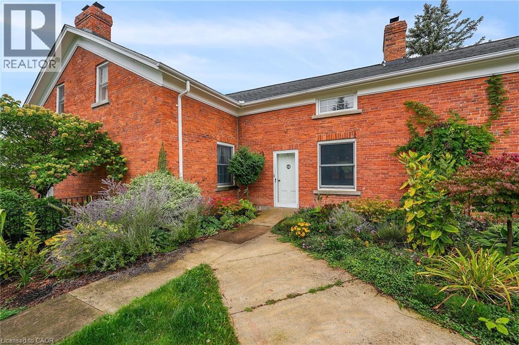 View of exterior entry featuring a chimney and brick siding - 2432 Seburn Road, Fonthill, ON - Outdoor