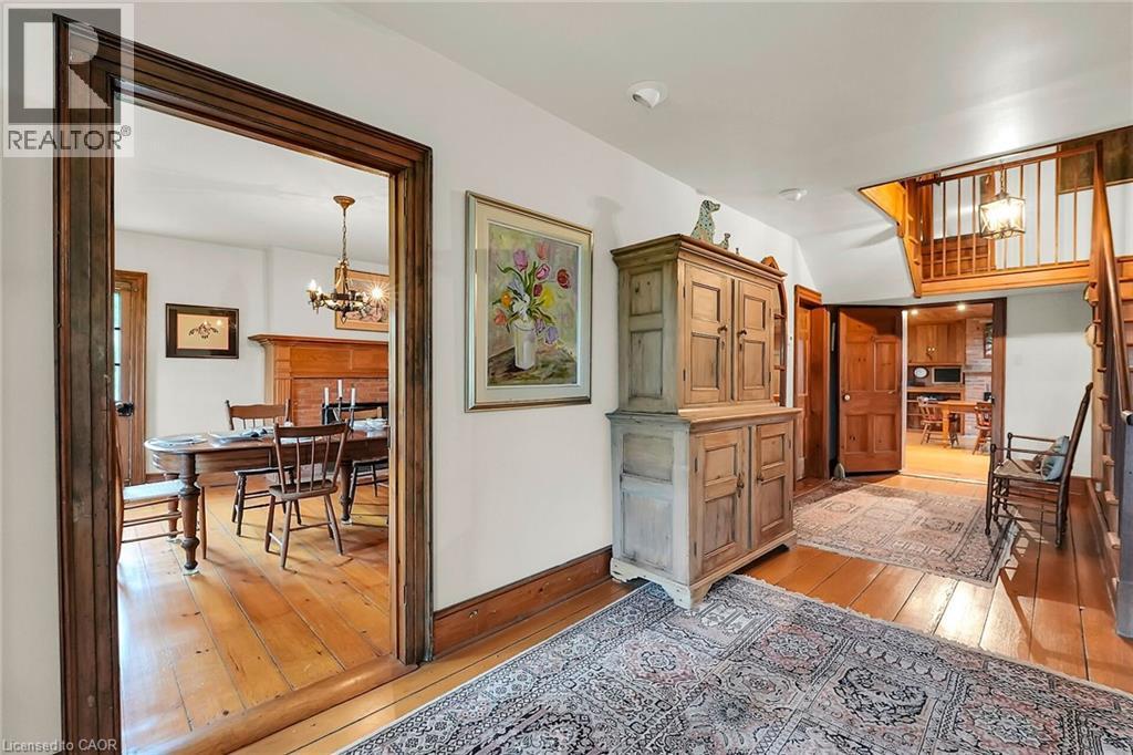Corridor featuring light wood-style flooring and suspended lighting - 2432 Seburn Road, Fonthill, ON - Indoor Photo Showing Other Room