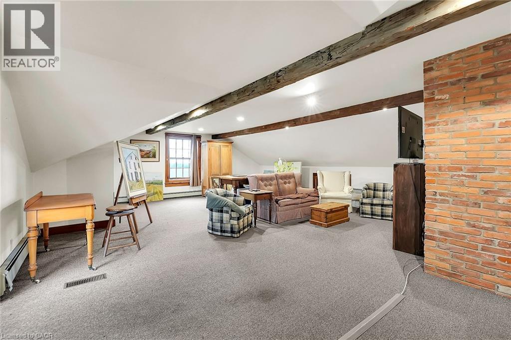 Living area with light carpet and vaulted ceiling - 2432 Seburn Road, Fonthill, ON - Indoor Photo Showing Other Room