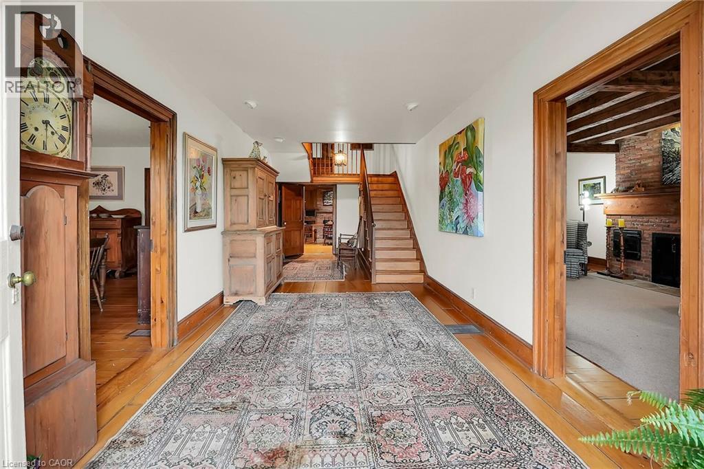 Corridor with stairway and light wood-style flooring - 2432 Seburn Road, Fonthill, ON - Indoor Photo Showing Other Room